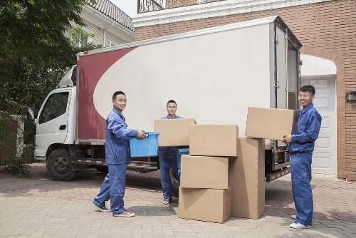 Man with van removal team loading furniture in Sheffield