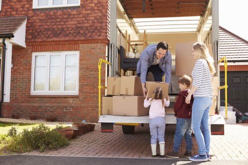Removal team loading furniture for a UK house move