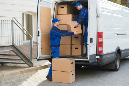 Loading boxes and furniture into a removals van