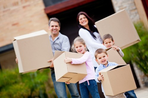 Moving team navigating stairs and access challenges in Sheffield property